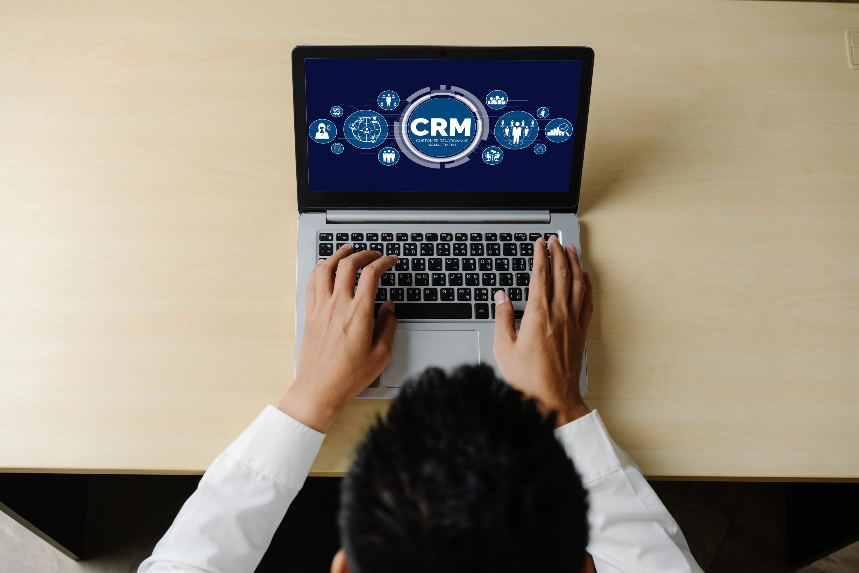 CRM dashboard on laptop for hotel management